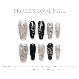 Detailed set of handmade press-on nails with 3D silver butterflies and sparkly rhinestones