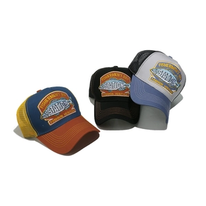 Three retro trucker hats with fish embroidery and breathable mesh in multiple colors
