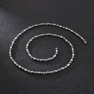 Polished silver stainless steel ball bead chain necklace in a spiral coil display