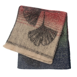 Macro detail of soft woven fabric featuring colorful ginkgo leaf jacquard patterns