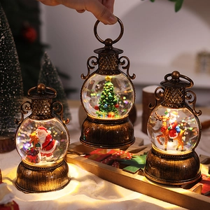 Vintage bronze Christmas lantern with Santa Claus and sparkling water glitter globe light
