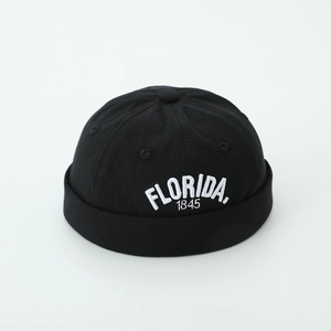 Close-up of black cotton docker hat with white Florida 1845 embroidery detail