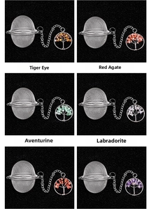 Detail view of various crystal stone tree of life charms on stainless steel tea strainers