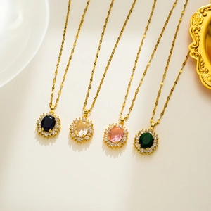 Macro shot of oval crystal zircon necklaces in black, yellow, pink, and green pendants