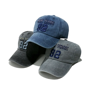 Vintage New York baseball caps in washed navy, charcoal, and grey with athletic embroidery