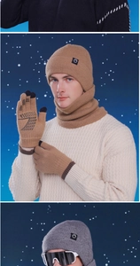 Close-up of winter knit set with beanie, neck warmer and touch screen gloves for men