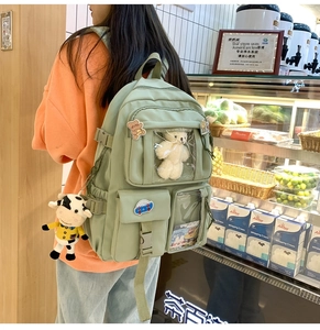 Zaino scolastico in nylon verde chiaro con tasche trasparenti e ciondolo a orso sulla schiena