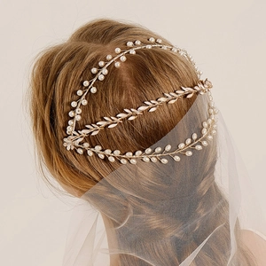 Handmade gold leaf bridal headpiece with white pearls and mesh veil for weddings