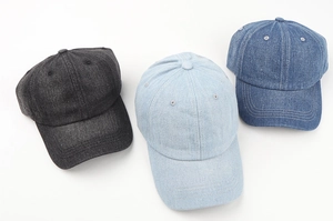 Three denim baseball hats in dark grey, light blue and medium blue with curved brims