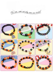Macro detail of Halloween acrylic charm beads and alloy pendants for jewelry making