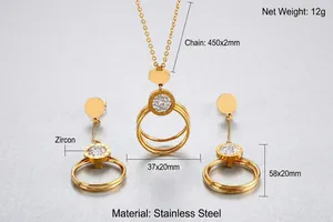 Detailed macro view of golden stainless steel necklace with Roman numerals and zircons