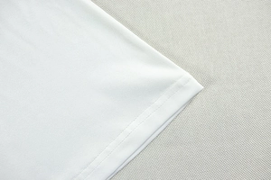 Detail view of reinforced double-needle stitching and smooth white knitted fabric texture