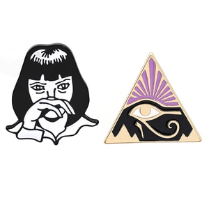 Fashionable enamel pins set featuring a minimalist girl and Egyptian Eye of Horus badge