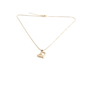 Close-up of heart-shaped gold necklace with MOM lettering and zircon accents