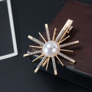Golden sunflower hair clip with a large pearl and sparkling rhinestones for women