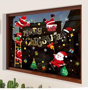 Détail de stickers de Noël avec Père Noël et texte Merry Christmas sur vitrine en verre