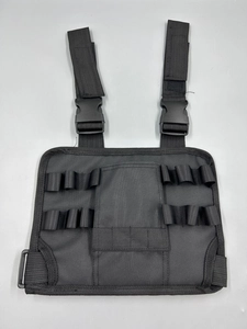 Front detail of black nylon tactical chest bag with adjustable straps and elastic loops