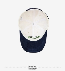 Detailed interior view of navy corduroy baseball cap showing lining and metal buckle