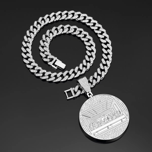 Macro view of silver Cuban chain and round Last Supper pendant with iced out rhinestones