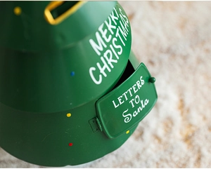 Detail of green metal Christmas mailbox with Letters to Santa and Merry Christmas text