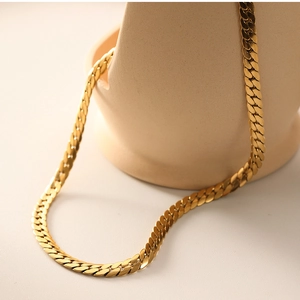 Detailed close-up of 18k gold-plated stainless steel flat snake chain necklace