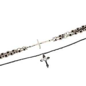 Detail of double-layer necklace with silver cross chain and black rhinestone cross pendant