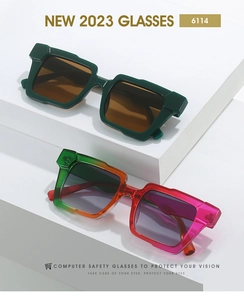 Detail view of square frame sunglasses in solid dark green and rainbow gradient colors