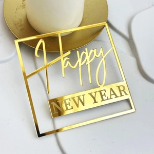 Golden acrylic Happy New Year cake topper in square frame on white background