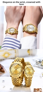 Detailed close-up of gold couple quartz watches with fluted bezel and rhinestone markers