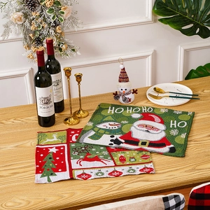Festive Christmas table placemat with HO HO HO text and jacquard woven santa pattern