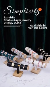 Detailed macro view of T-shaped jewelry stands with velvet finish and wooden bases