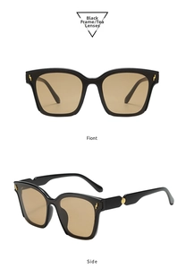 Detail of square sunglasses with black frames, tea lenses, and gold lightning accents