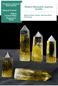 Group of natural citrine quartz crystal pillars with internal ice cracks on black fabric
