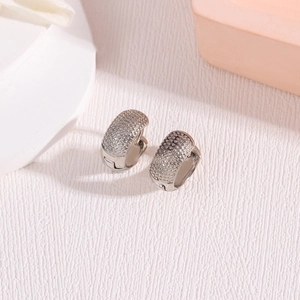 Silver plated copper hoop earrings with embossed dotted texture in a minimalist French style