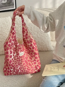 Pink leopard print fabric tote bag for women featuring a minimalist brand label