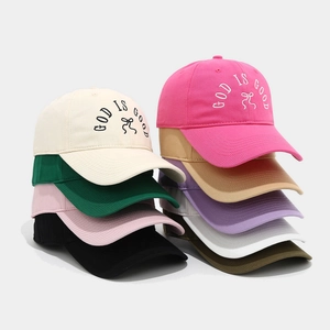 Fashionable cotton baseball cap with embroidered bow and God Is Good text in multi colors