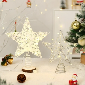 Illuminated Christmas tree topper stars with warm LED lights and elegant base support