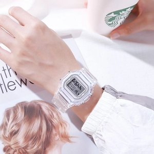Close-up of a transparent square digital watch with LED display on wrist
