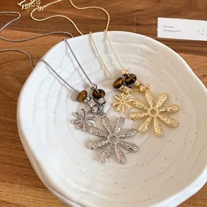 Tiger eye beaded necklace with pleated daisy flower pendant in gold and silver finish