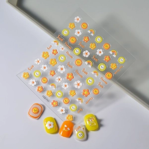 5D embossed nail stickers featuring sunflower, rainbow, and smile patterns on nail tips