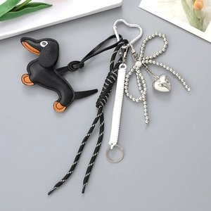 Stylish black leather dachshund dog keychain with woven rope and silver heart charm