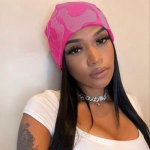 Pink knit beanie with abstract pattern for winter street style fashion headwear