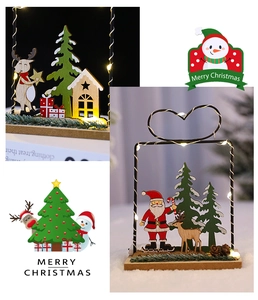 Detail of Christmas wooden LED light decor featuring Reindeer and Santa under black metal frame