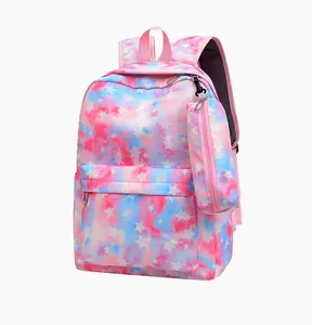 Detail view of pink and blue tie-dye backpack with white stars and a matching side pouch