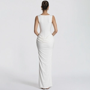 Detail view of white bodycon dress featuring back zipper and elegant ruched texture
