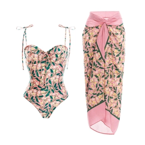 Floral print one-piece swimsuit and matching sarong set for beach vacation