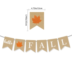 Detail view of burlap Hello Fall banner with pumpkin and dimensions in inches and cm