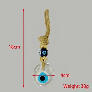 Detailed view of 18cm Turkish Evil Eye wall hanging with golden beads and jute rope