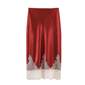 Elegant red satin midi skirt with delicate white lace trim detail in a flat lay view