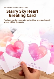 Close-up of romantic watercolor star heart folding greeting card with love text
